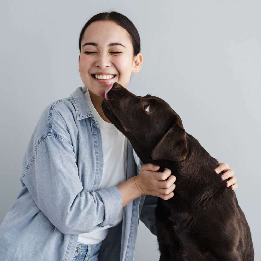 Resident with her dog at Glenwood Garden Apartments in Mountain View, California