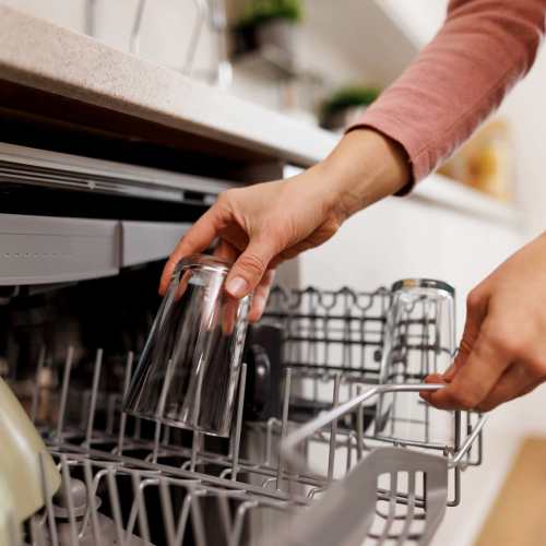 Resident using dishwasher at Taneytown Crossing in Taneytown, Maryland