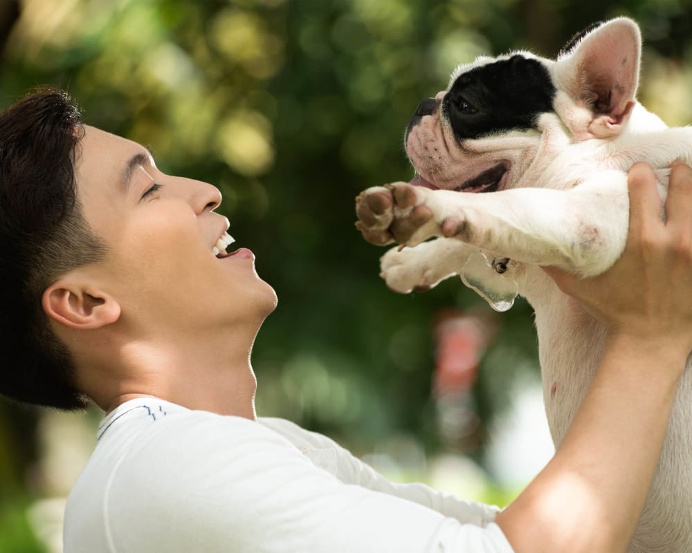 Resident and his dog posing for a photo outside at Vive in Chandler, Arizona