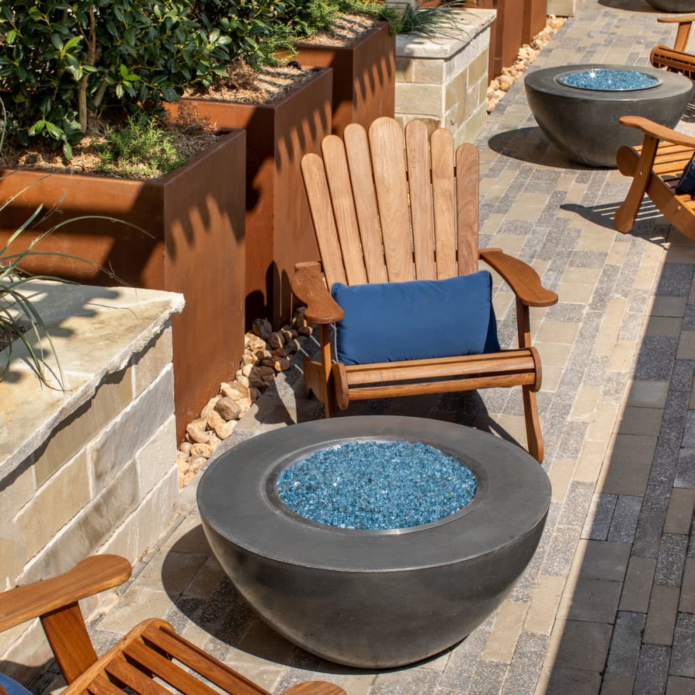 Adirondack chairs around fire pits at Magnolia Heights in San Antonio, Texas