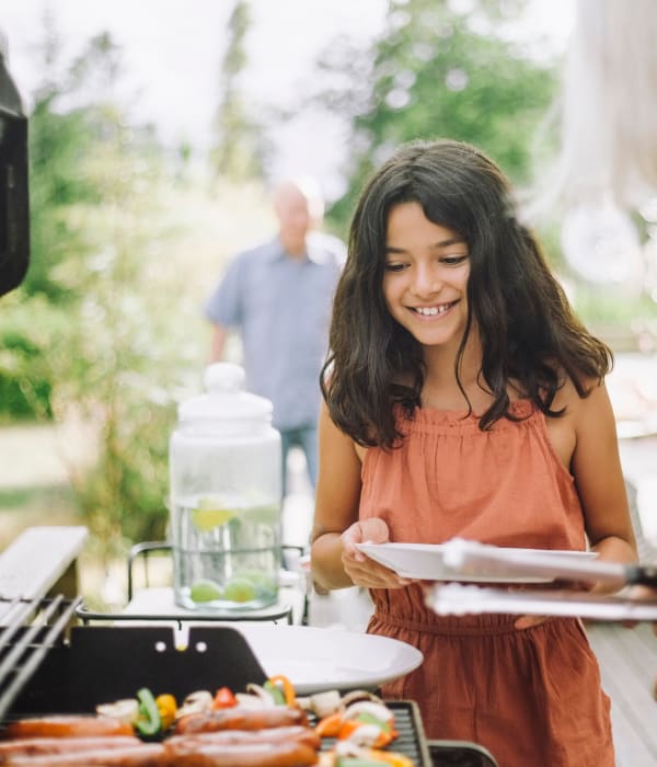 young girl getting dinner from the bbq at Adagio in Sacramento, California