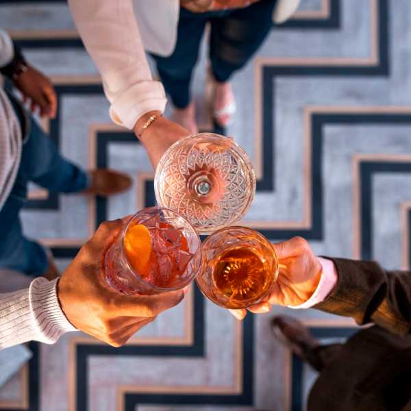 Friends enjoy cocktails near Mason Avenue, Alexandria, Virginia
