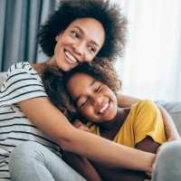Mother and daughter having happy moment in their apartment home at Box Board Lofts in Grand Rapids, Michigan