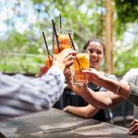 Residents enjoying drinks in a restaurant near St. James in Dallas, Texas