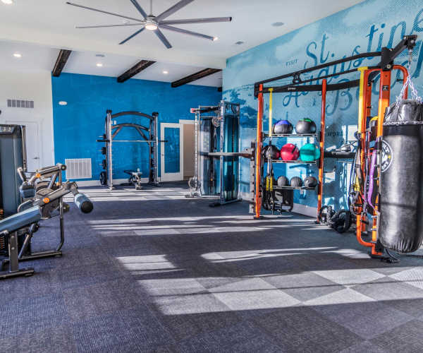 Community fitness center with gym equipment and workout area at Brisa at St. Augustine in St. Augustine, Florida