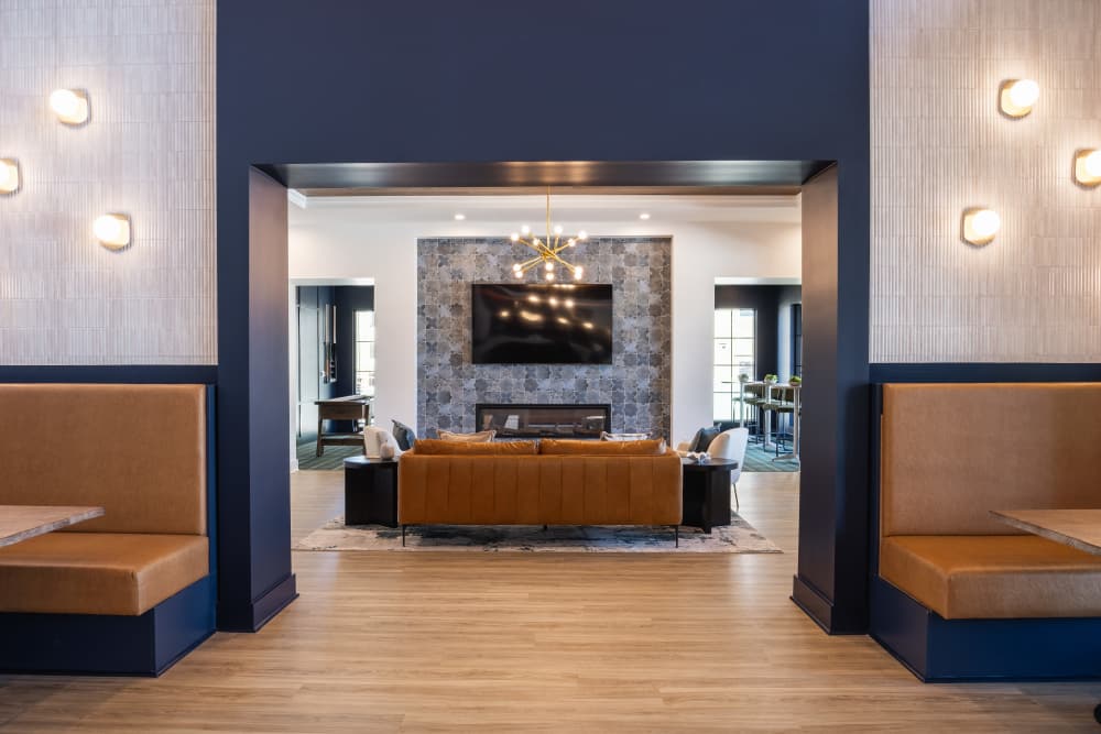 Clubhouse lounge with seating and lighting accents at The Flats at Crosspointe in Columbia, South Carolina