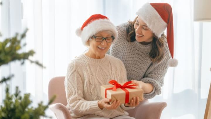 Senior and daughter with Christmas gift