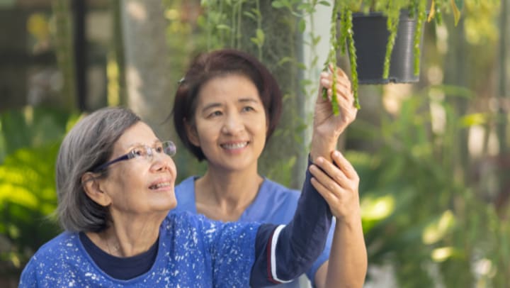 Two woman smiling