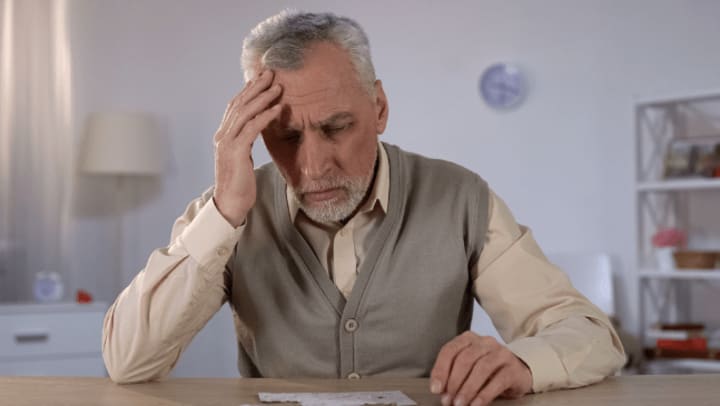 senior with headache