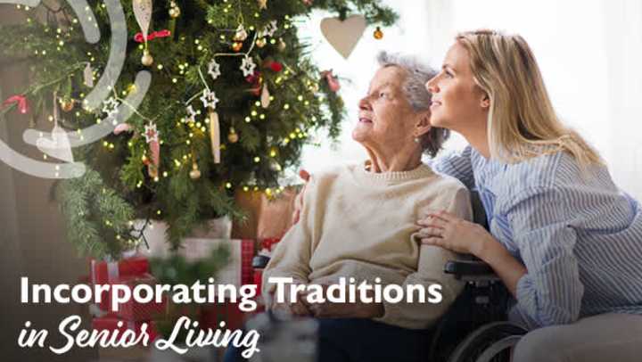 a senior woman and adult child by Christmas tree