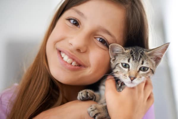 Girl holding kitten at StoneCrest Village in Halifax
