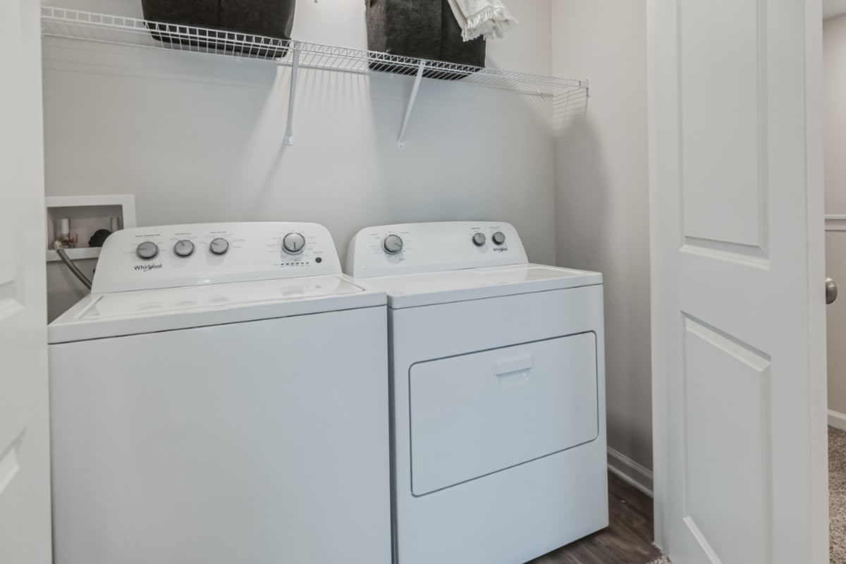 A full-sized washer and dryer in an apartment at Artisan Living North Beach in Santa Rosa Beach, Florida