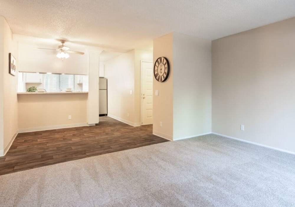 Unfurnished living room with close access to kitchen and dining area at Amber Court in Fremont, California,