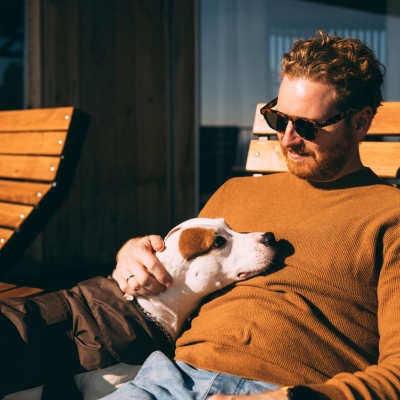 Man with his dog at The Parker at Seventh in Des Moines, Iowa