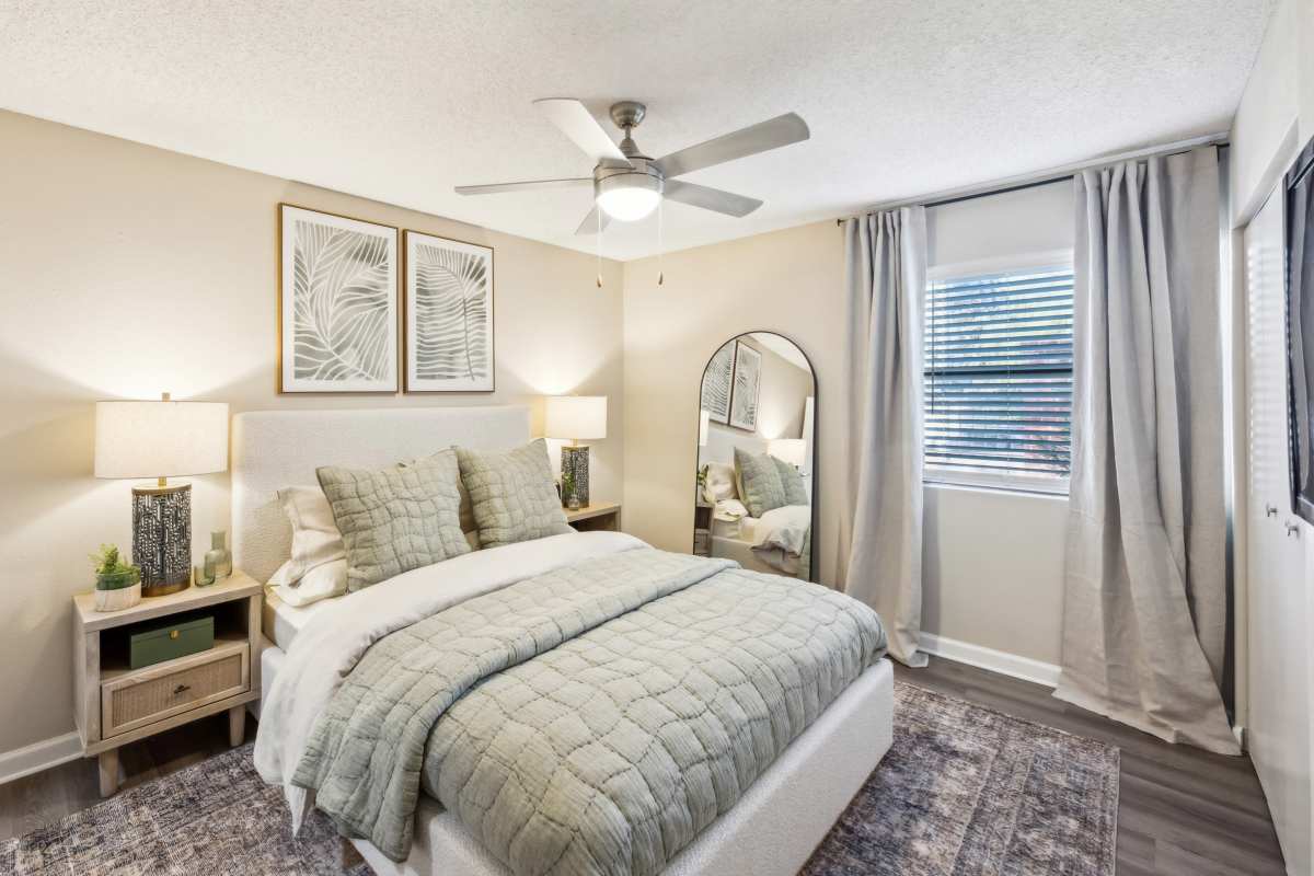 Resident bedroom with ceiling fan at Cypress Pointe in Louisville, Kentucky