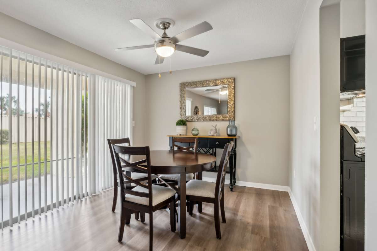 Resident dining space with wood-style flooring at Buena Vista in Seminole, Florida