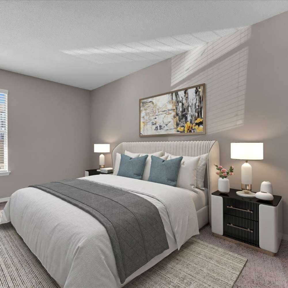 Inviting bedroom with a neatly made bed at Woodbrook in Gardendale, Alabama