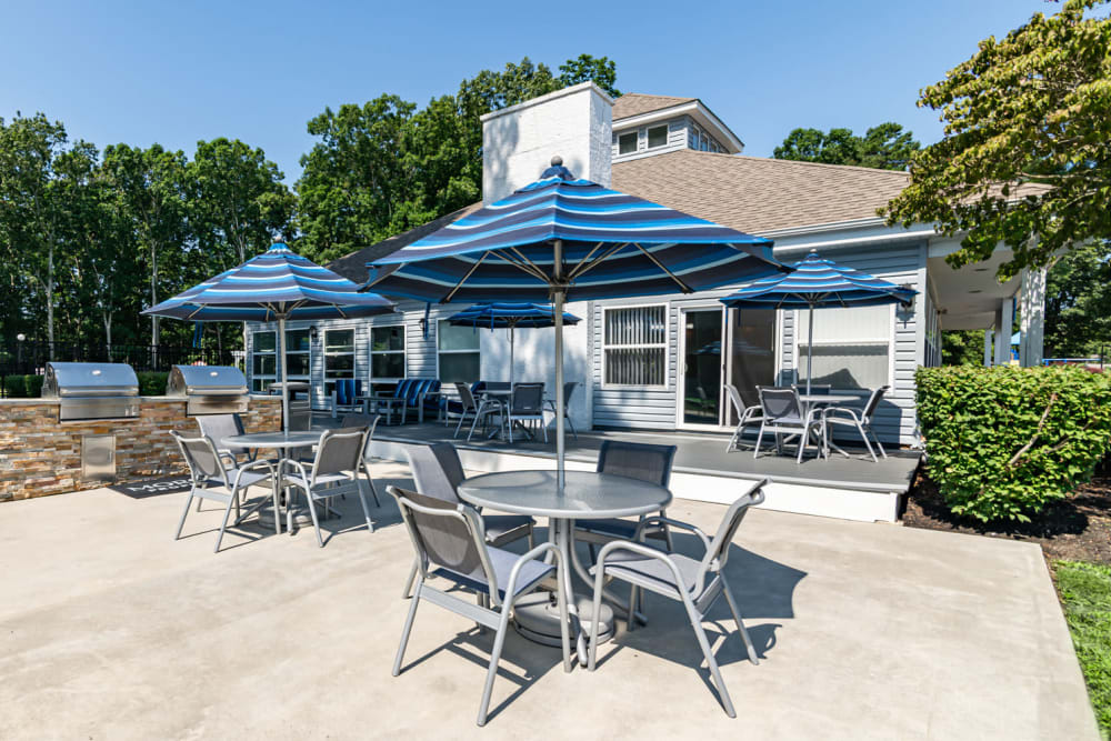 Grilling stations with outdoor seating at The Landings Apartment Homes in Absecon, New Jersey