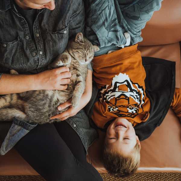 Family on couch with pet cat at Elevations One, Woodbridge, Virginia