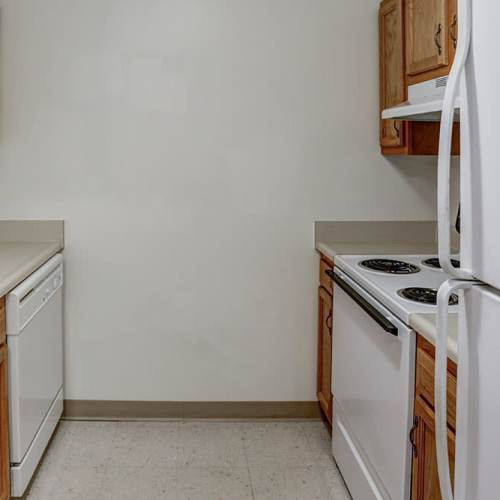 White appliances and wooden cabinets at Laurelhurst in Clyde, Ohio