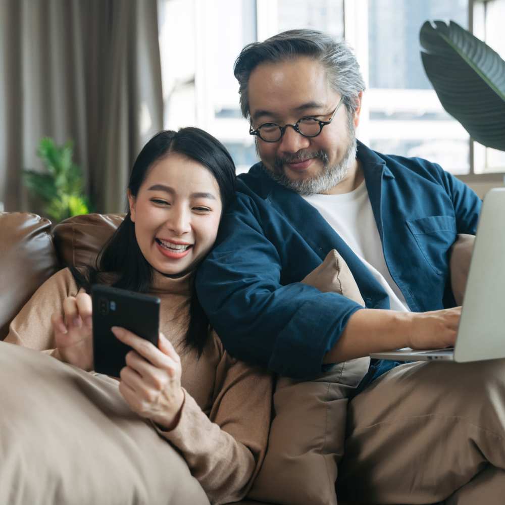 Father and daughter in their living room at Devonwood Apartments in Fayetteville, North Carolina