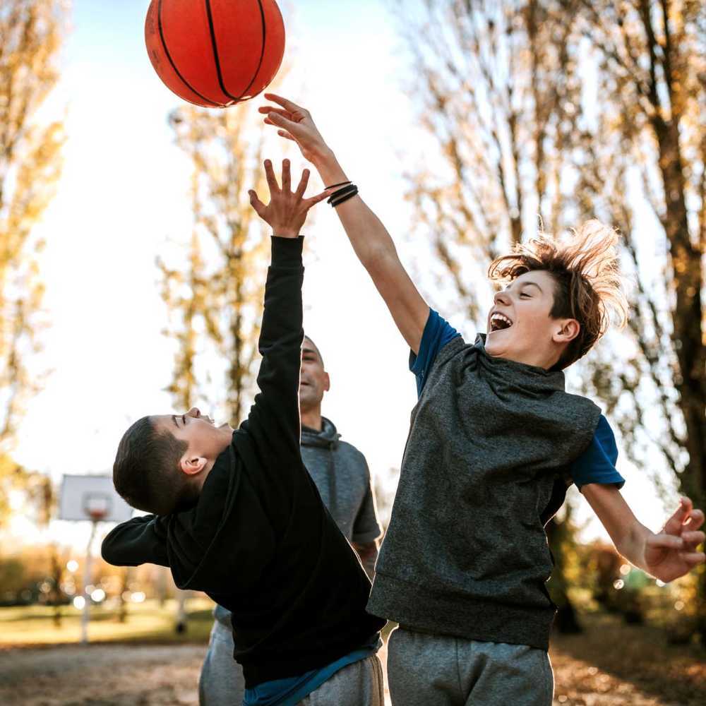 Kids playing basketball at Trio Terraza in El Paso, Texas