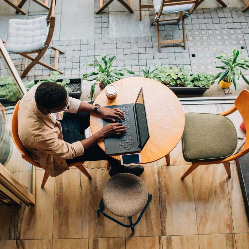 Resident getting some work done from his favorite café near Oaks Pentagon Village in Edina, Minnesota