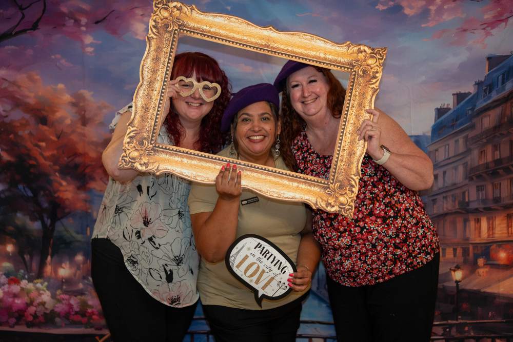 Employees having fun at holiday party at Ray Stone Inc.