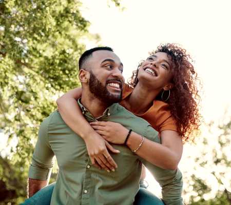 Couple having a good time at the park near Terrace Garden Apartment Homes in San Leandro, California