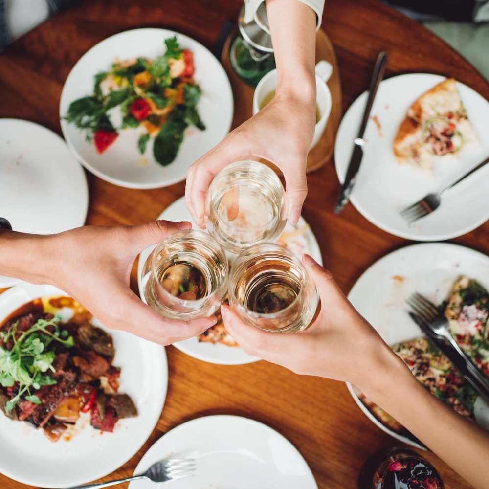 Residents having their favorite food and drinks at a restaurant nearby Copper Hills Apartments in Houghton, Michigan