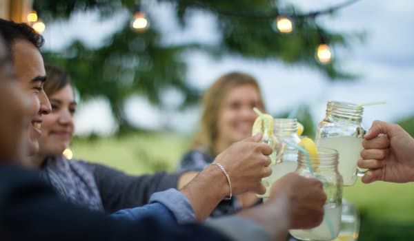 Residents having drinks outside at Orchard Park Apartments in Clarksville, Tennessee