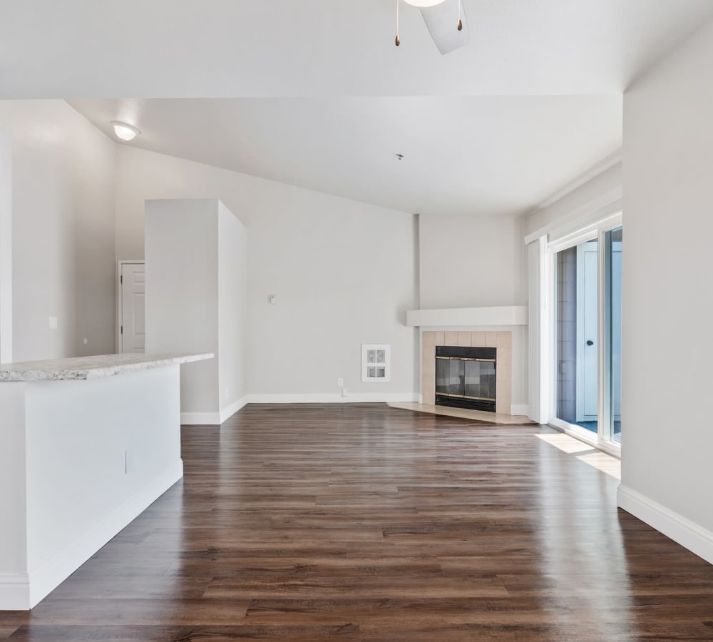 Living room with fireplace at Quail Hill Apartment Homes in Castro Valley, California