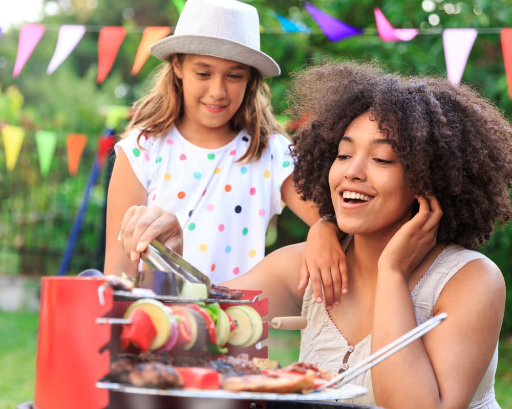 a mother and daughter outside at a bbq near Howard Gilmore Terrace in La Mesa, California