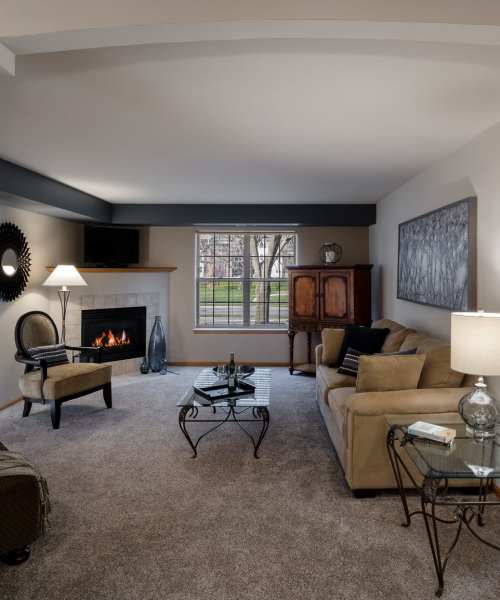 Living room with carpet flooring at Deer Creek in Middleton, Wisconsin