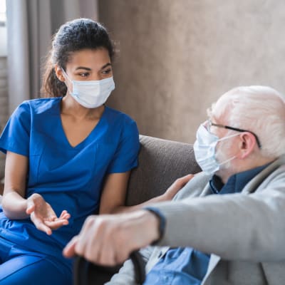 Nurse and resident chatting about care options at Peoples Senior Living in Tacoma, Washington