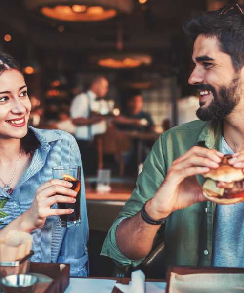 Resident couple in cafe near The Residences at Creighton Waterway in North Port, Florida