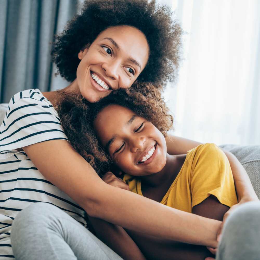 Family hugging at 300 Optimist Park in Charlotte, North Carolina