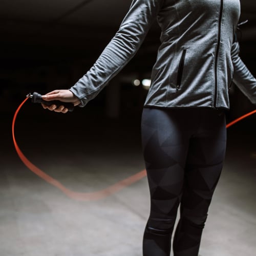A resident exercising with a jump rope in a gym near Bayview Hills in San Diego, California