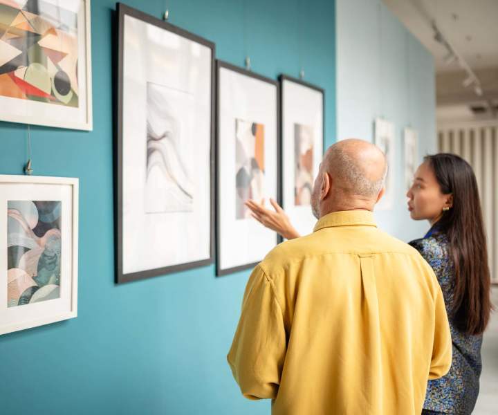 Residents exploring museum of art near Skyline Tower in Fort Wayne, Indiana