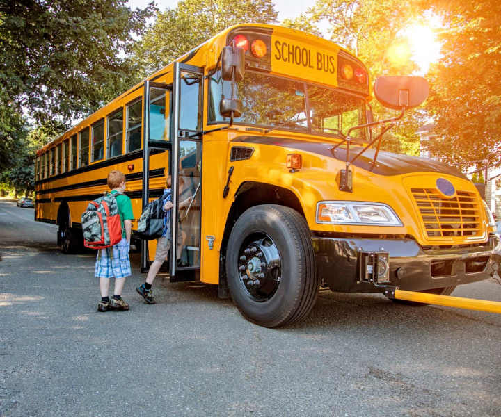 Kids boarding the school bus near Ardenwood Forest Rental Condominiums in Fremont, California