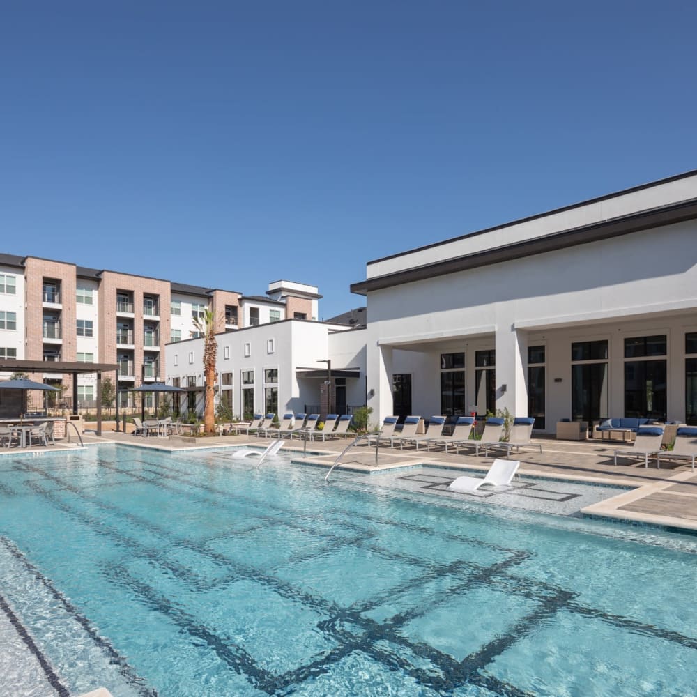 Luxurious inground pool with lounge chairs at Bellrock La Frontera in Austin, Texas