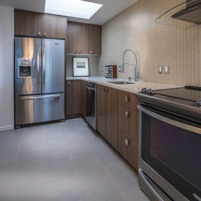 Contemporary kitchen with upgraded appliances at Panorama Apartments in Seattle, Washington