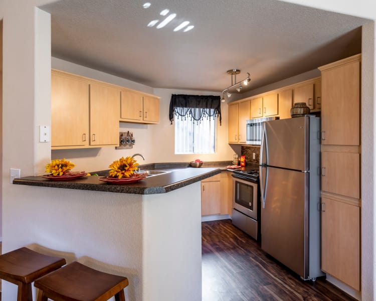 Kitchen features granite countertops at Broadstone Heights in Albuquerque, New Mexico