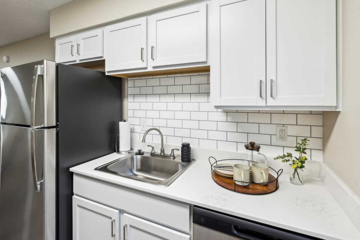 Modern kitchen with stainless appliances at Cypress Pointe in Louisville, Kentucky