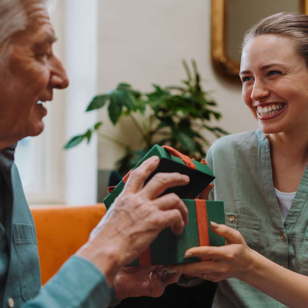 Staff laughing with resident at Clearwater Beaverton in Beaverton, OR