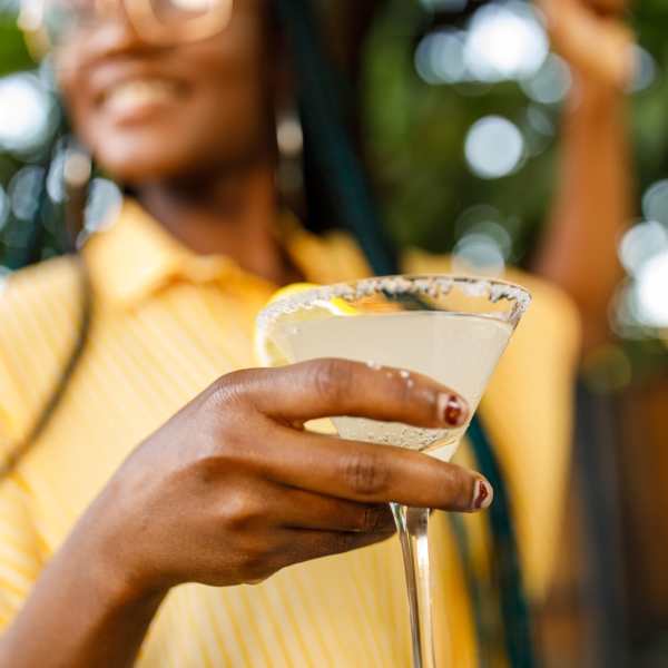 A resident enjoys a cocktail near Infinity at Centerville Crossing, Virginia Beach, Virginia