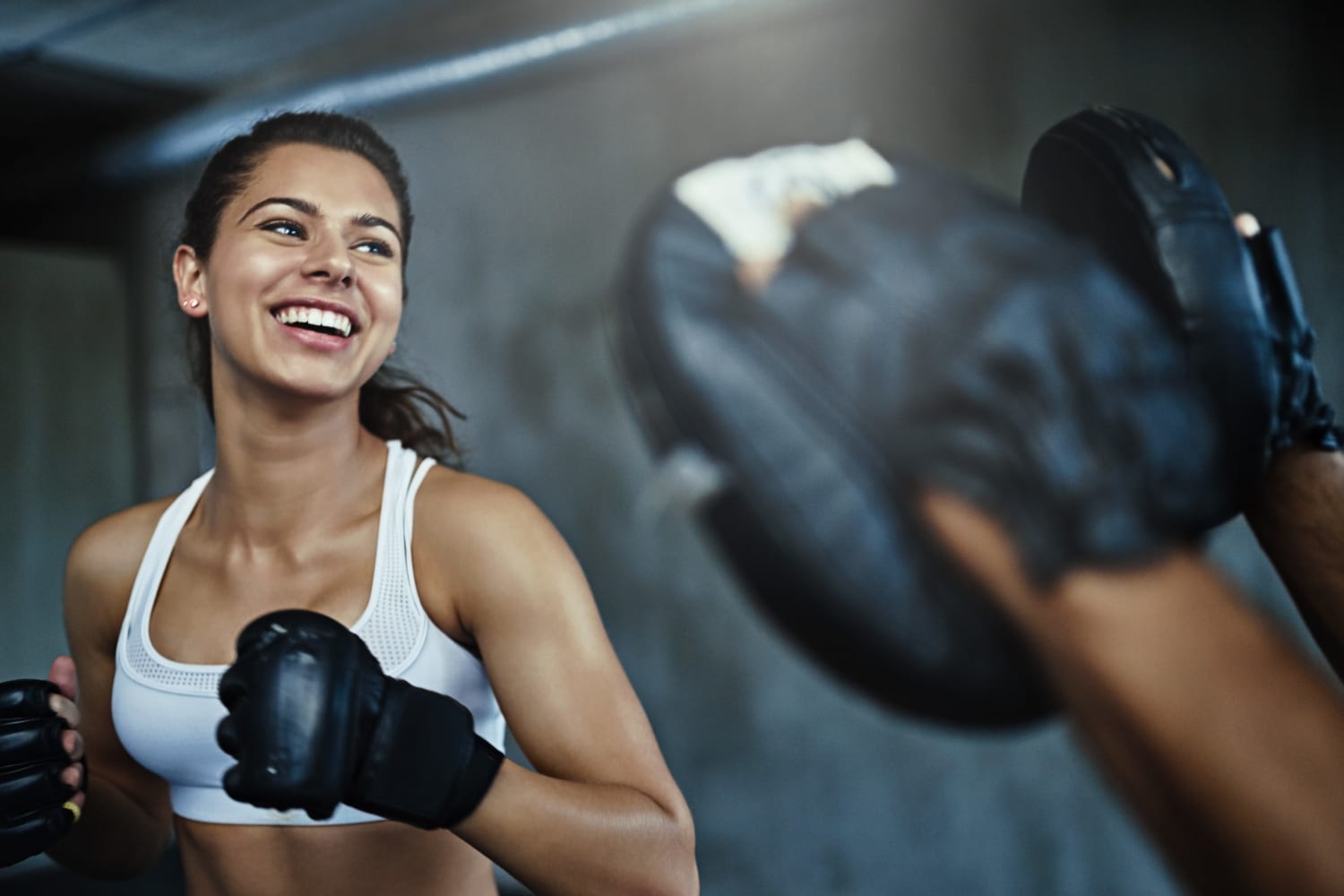 Woman working out in the resident fitness center at Bull Run Townhomes in Fort Collins, Colorado