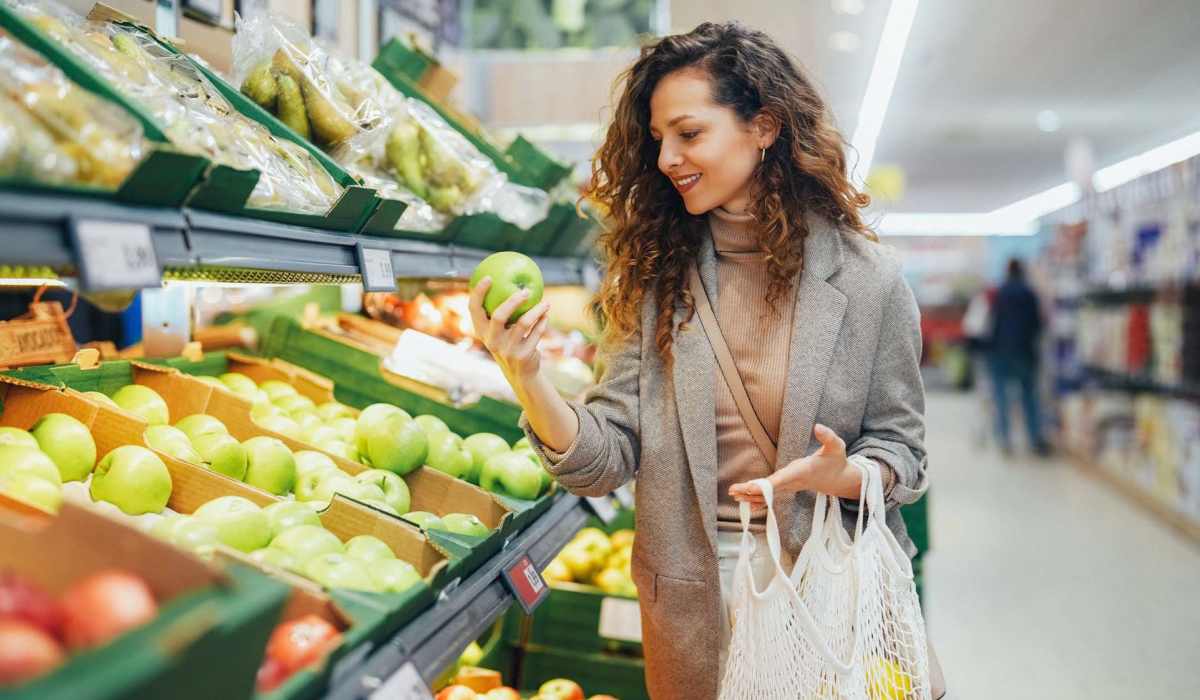 Resident woman shopping fruits in a nearby local market at Madison Park in Madison, Alabama