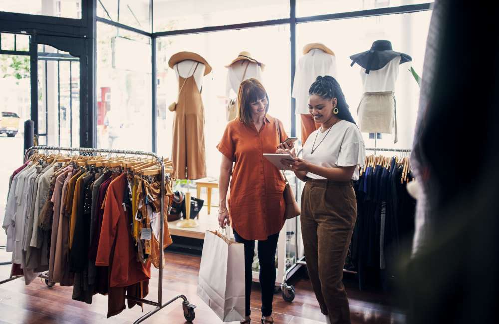 Women shopping clothes at a store near Jefferson Cunningham Apartments in Los Angeles, California