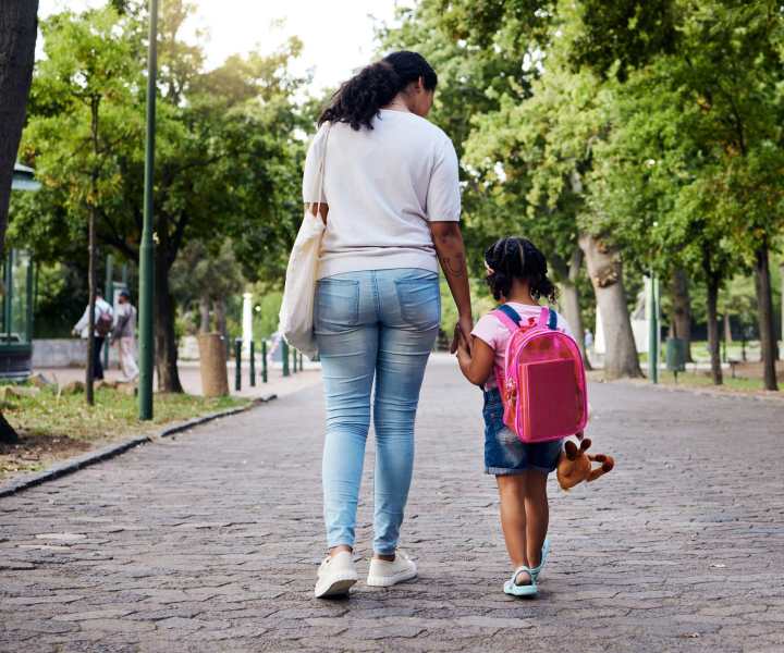 Resident picking up her daughter from the school at Huffman Mill Townhomes in Burlington, North Carolina